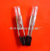 Two 24V 50MA T6.8GX44 telephone lamps with clear bulbs and black bases on an orange background